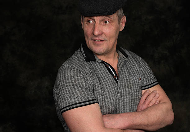 istock portrait of handsome serious senior man 621705724