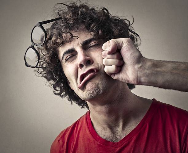 Punch Portrait of a man who getting a punch from someone punch stock pictures, royalty-free photos & images