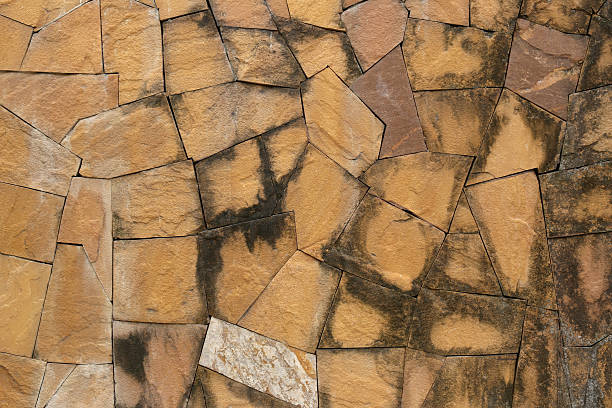 istock old stone wall Texture in weathered and have natural surfaces. 621708162