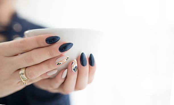 istock woman's hands with a cup of hot drink 621710144
