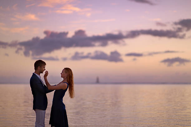 istock Beautiful romantic couple on a tropical beach 621711248