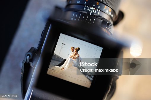 istock Shooting a wedding with a vintage camera 621711304