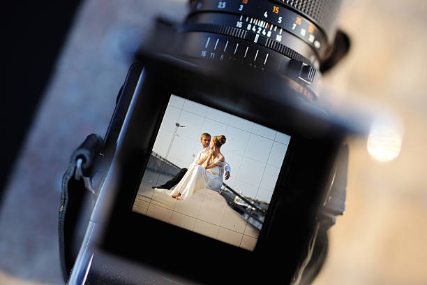 Shooting a wedding with a vintage camera stock photo