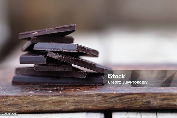 Stack Of Broken Chocolate Bar Pieces Stock Photo - Download Image Now - Dark Chocolate, Chocolate, Cacao Fruit