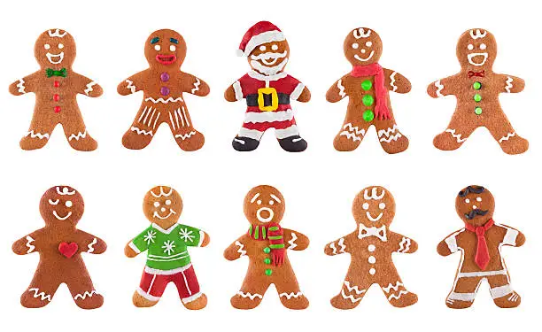 Photo of Collection of various gingerbread men on a white background