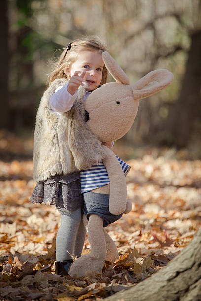 istock toddler and her teddy bear 621713472