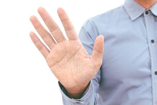 istock Man give stop hand sign gesture isolated on white background 621713568