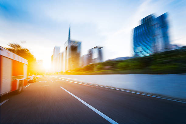 istock modern buildings in guangzhou from empty asphalt at sunrise 621714276