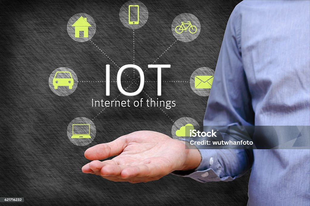 Internet of things (IoT) concept. Man show iot link network Internet of things (IoT) concept. Man show iot link network and symbol connected with icons Internet of Things Stock Photo