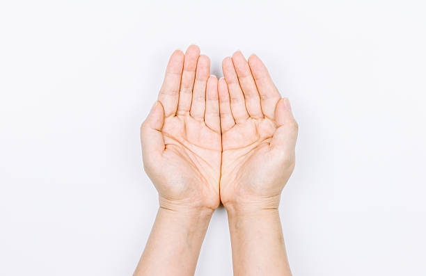 istock Woman hand holding something on white background 621717570