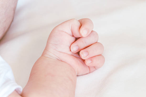 istock New born baby hand 621717884