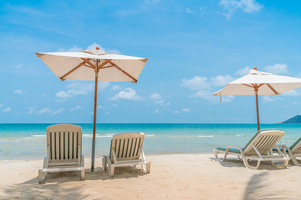 istock Beach chairs on tropical white sandy beach 621718222