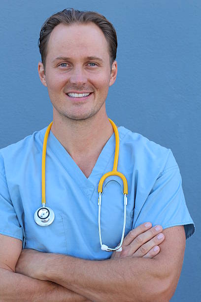 istock Health care worker with stethoscope smiling 621720086