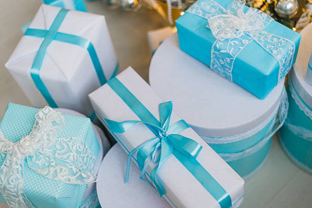 istock Christmas gifts under the decorated tree in blue 621721936