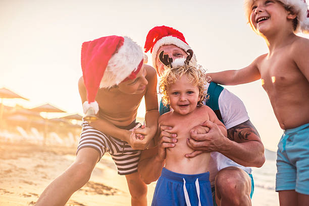 istock Christmas with my boys at the beach 621724106