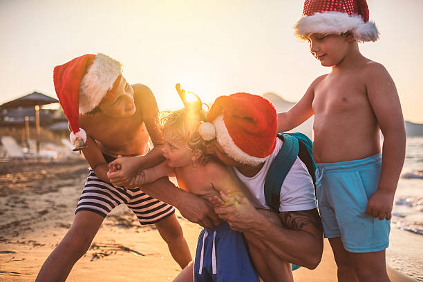 istock Christmas with my boys at the beach 621724474