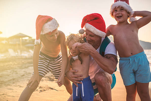 istock Christmas with my boys at the beach 621724686