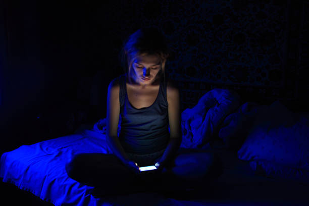 istock young women using the smart phone on bed before sleep 621725246