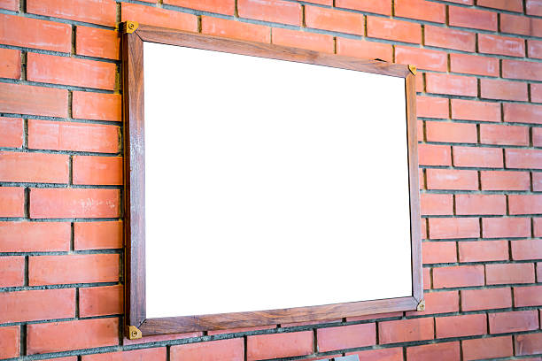 istock Blank wood sign on brick wall 621725346