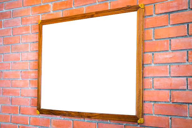 istock Blank wood sign on brick wall 621725392