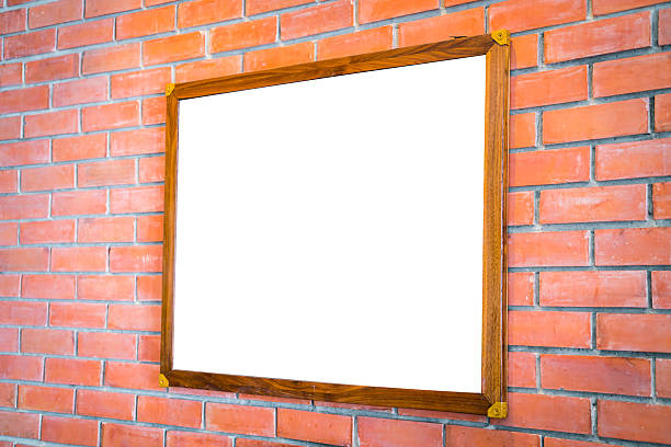 istock Blank wood sign on brick wall 621725424
