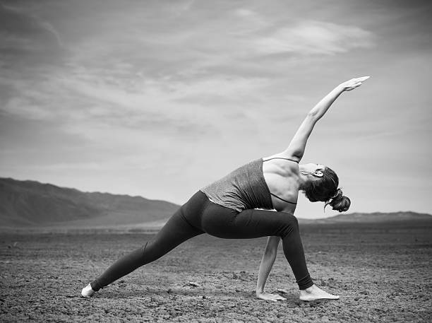 istock Hispanic Women Doing Yoga In The Desert 621725992