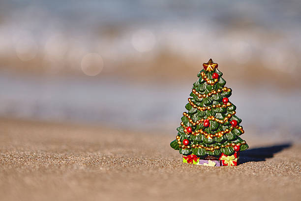 istock Candy canes on the beach. holiday vacation concept 621726292