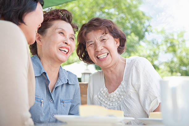 istock Senior women talking together at lunch 621726498