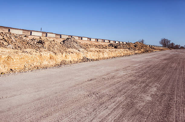 istock Road construction process. Highway repair and maintenance 621727700
