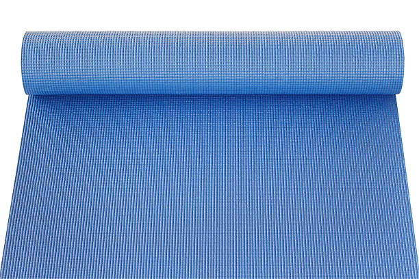 istock Blue yoga mat isolated on white 621727714