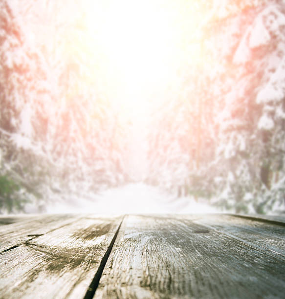 istock Wooden table in winter forest 621728786