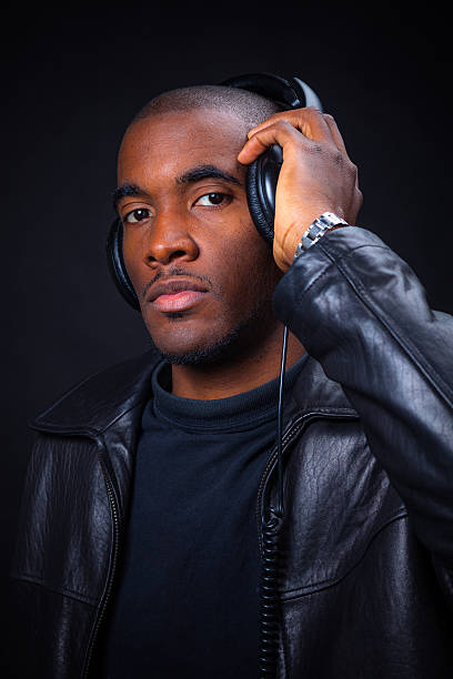 istock Young African American Man Posing in Studio with Headphones 621728868