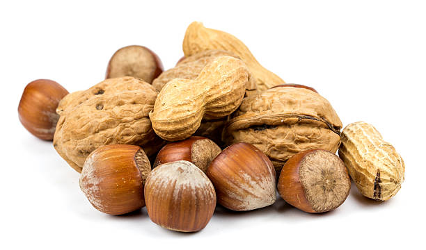 istock assortment of nuts, isolated on white 621728886