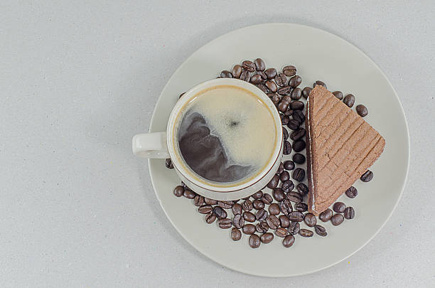 cup of coffee with slice chocolate cake on white background - latté hot chocolate hot drink indulgence imagens e fotografias de stock