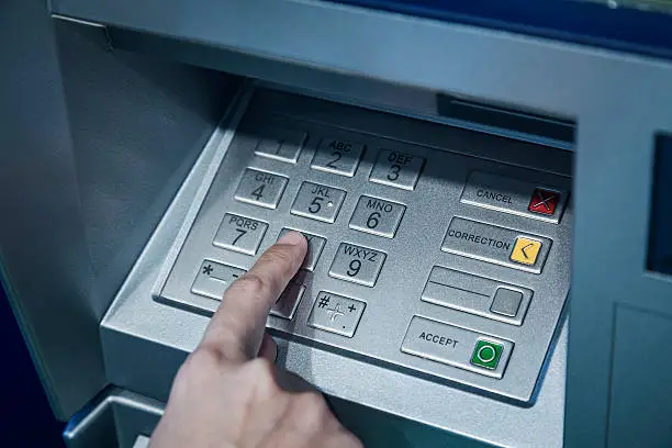 Password code protection Hand on button number Banking automatic teller machine