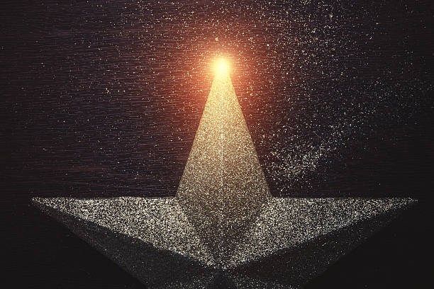 Christmas star on dark wooden background close-up.