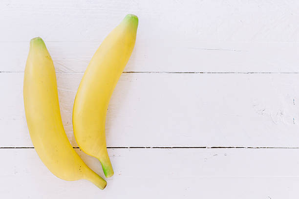 istock Banana  on wooden background 621731804