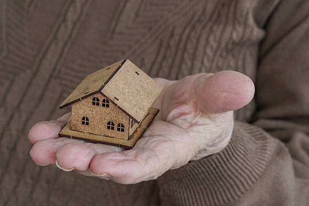 istock Holding a small house on palm 621732466
