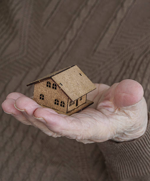 istock Holding a small house on palm 621732672