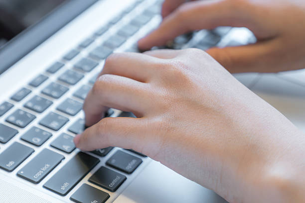 istock Close-up of hands typing on a keyboard 621732964