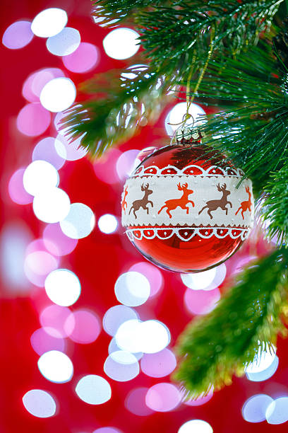 istock Hanging red christmas ball on abstract background 621733520