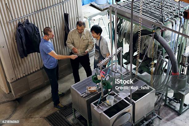 Men Holding A Meeting In A Factory Stock Photo - Download Image Now - Factory, Japanese Ethnicity, Industry