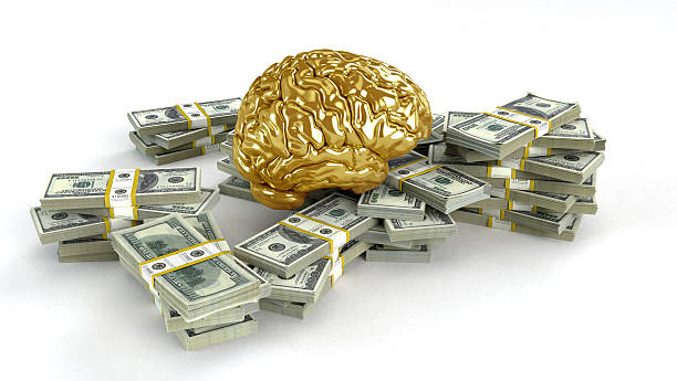 istock Human gold brain whith Heap of Dollar Bills . 621819896