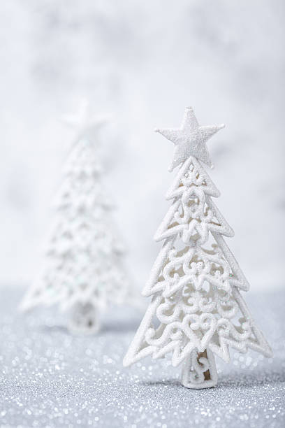 istock Sparkly glitter Christmas trees in silver and white. 621820094