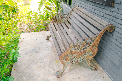 Wood Bench against a brick wall