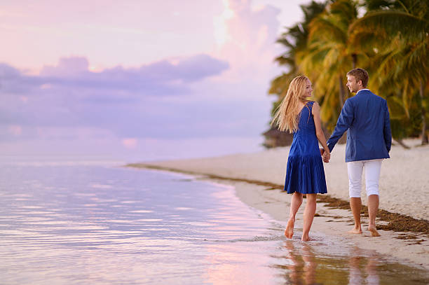istock Beautiful romantic couple on a tropical beach 621820604
