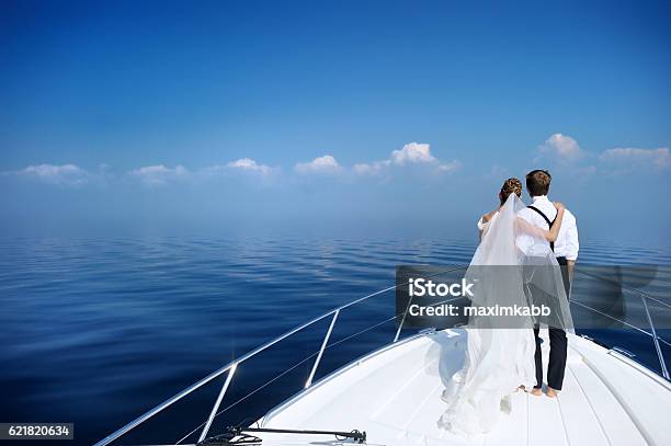 Happy Bride And Groom On A Yacht Stock Photo - Download Image Now - Wedding, Yacht, Adult