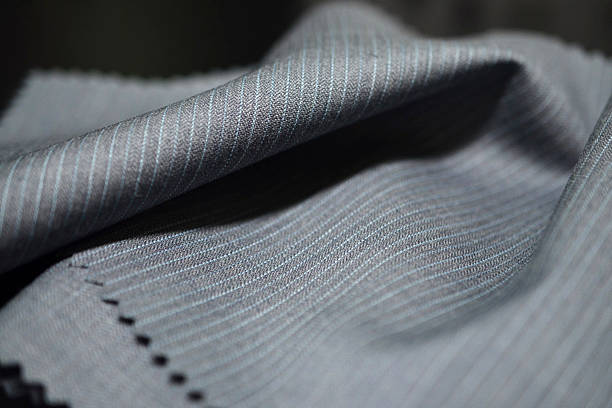 istock close up texture gray fabric with blue line of suit 621821388