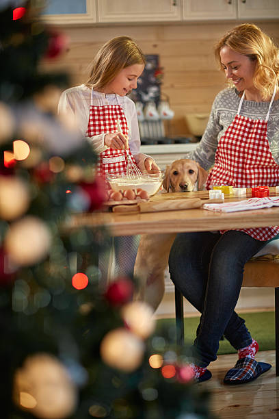istock Mother and daughter making cookies for Christmas 621822400