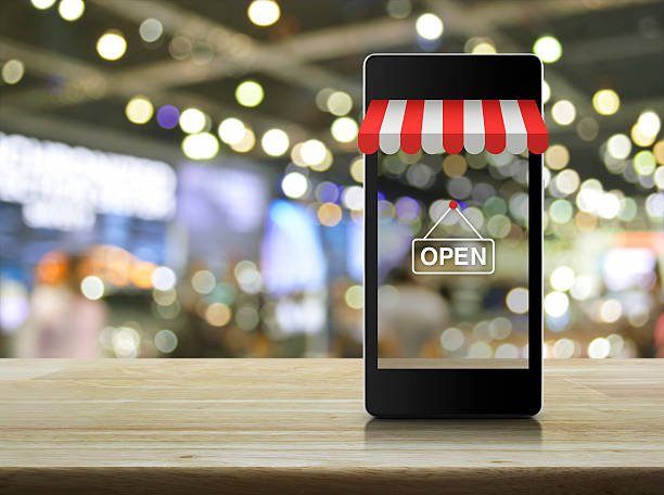modern smart mobile phone with on line shopping store graphic - print shop imagens e fotografias de stock